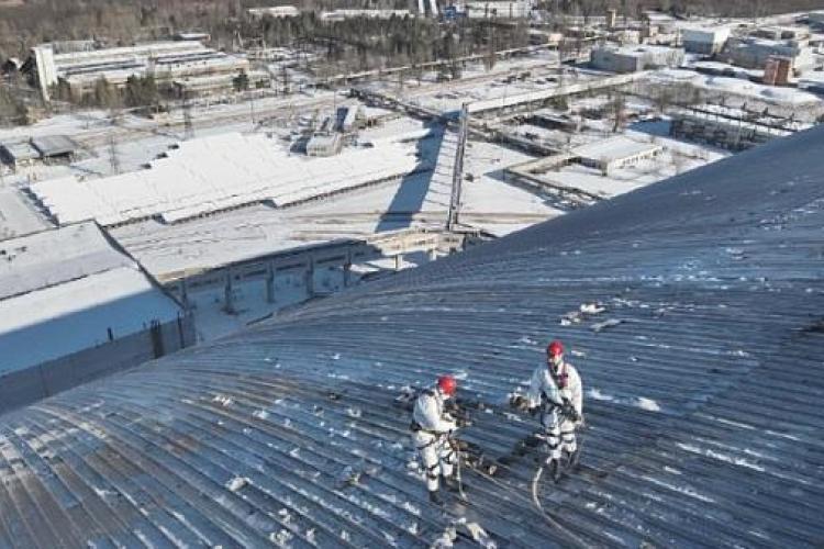 Workers on the roof of the shelter after the drone strike Workers on the roof of the shelter after the drone strike